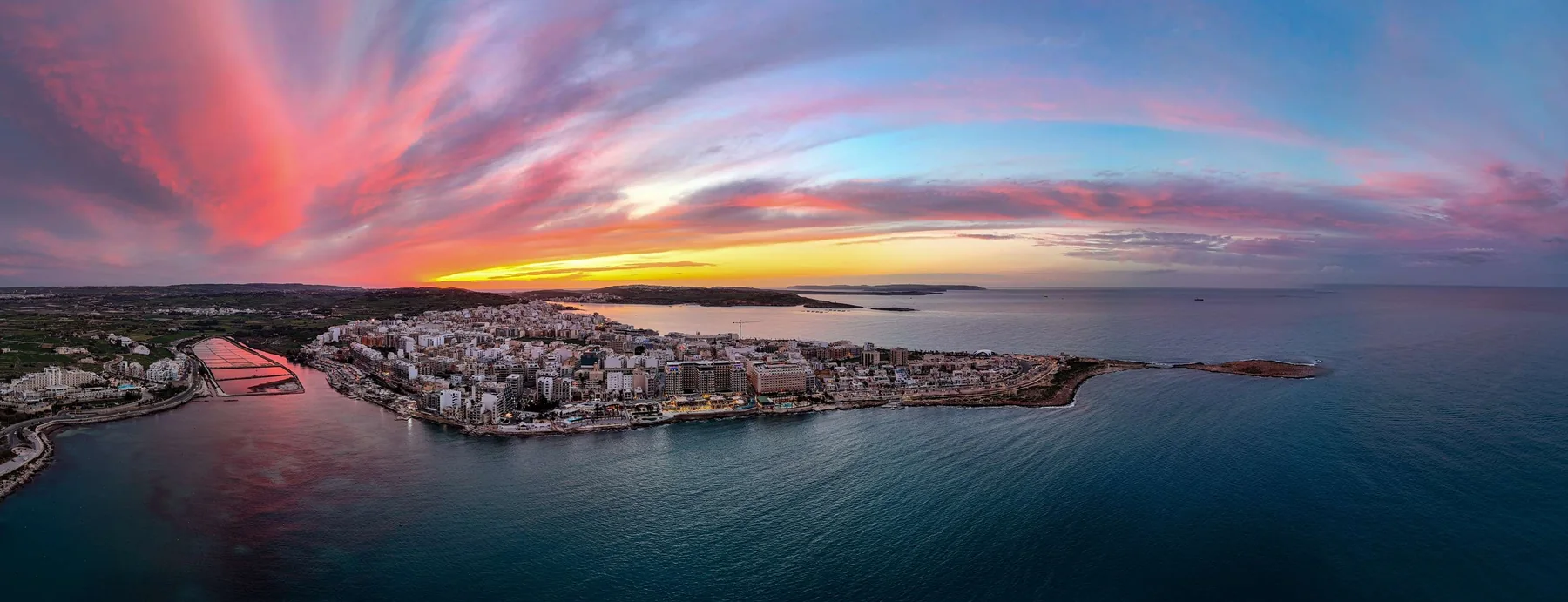 Wide aerial panorama over Malta at sunset